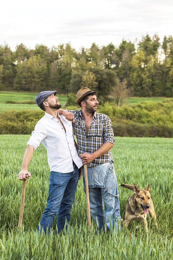 two men standing in a field